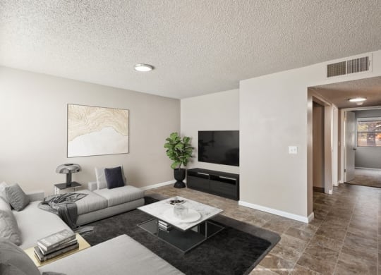Model Living Room with Wood-Style Flooring at Bella Vista Apartments in St. George, Utah.