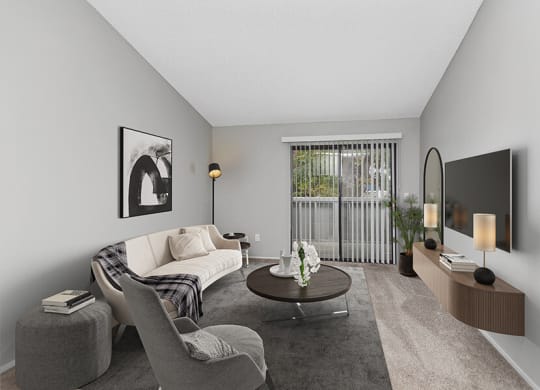Model Living Room with Carpet and Patio Accessibility at The Meritage Apartments in Vallejo, CA.