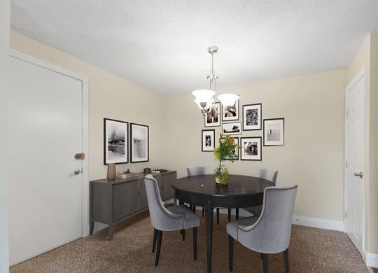 Model Dining Room with Carpet at Meadows at Marlborough Apartments in Boston, MA.
