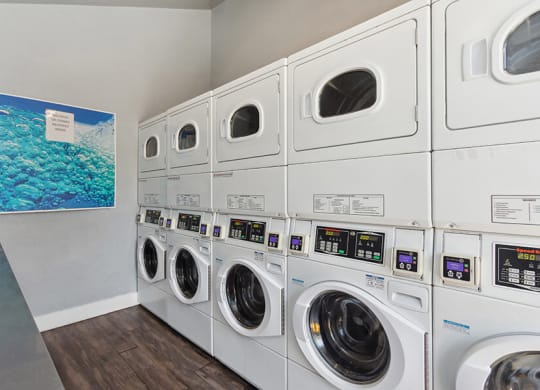 Community Laundry Center with stacked Washing Machines & Dryers at The Archer Apartments in Sacramento, CA.