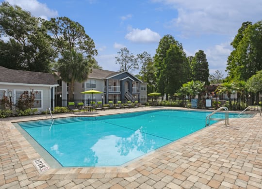 Swimming pool and pool deck at Retreat at Crosstown Apartments