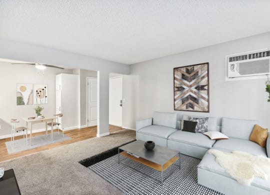 Model living room with view of dining