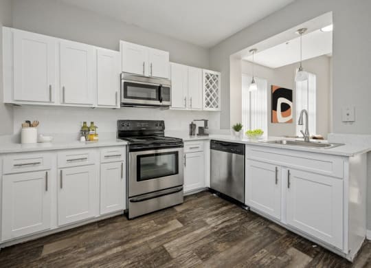 Model kitchen showcasing stainless steel appliances