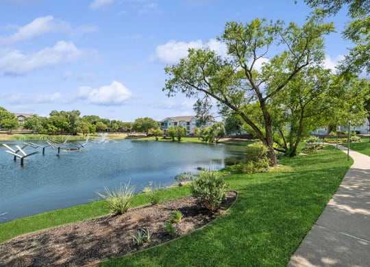 Community Pond with Fountain at Essence Apartments in Dallas, TX.