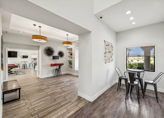 Community Clubhouse with Game Tables and Lounge Furniture at Stonegate Apartments located in Las Vegas, NV.