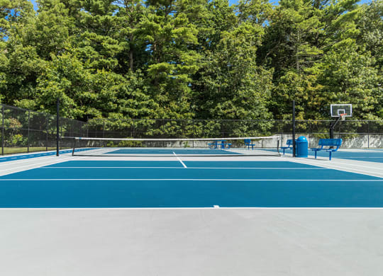 Community Pickleball Courts with Nets at Village at Marshfield Apartments located in Marshfield, MA.