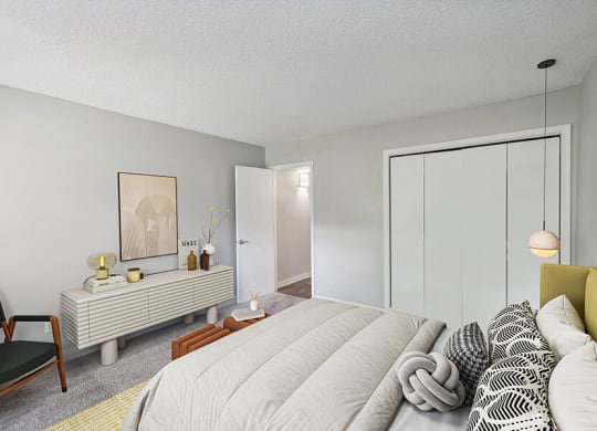 Model Bedroom with Carpet and Closet at Indigo Park Apartments located in Albuquerque, NM.