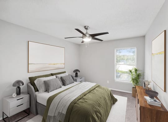 Model Bedroom with Carpet and Window View at Vue at Baymeadows Apartments in Jacksonville, FL.