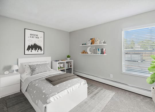 Model Bedroom with Carpet and Closet at Waterfront Apartments in Lakewood, CO.