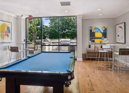 Community Clubhouse with Game Tables and Lounge Furniture at Mason Van Dorn Apartments located in Alexandria, VA.