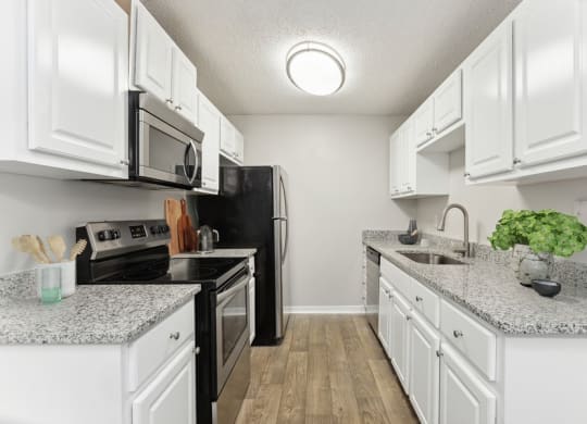Model kitchen with white cabinets