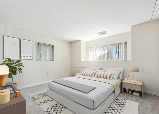Model Bedroom with Carpet and Window View at Heights Marlborough Apartments in Boston, MA.