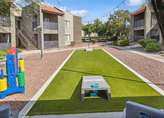 Outdoor Corn Hole Area at Saddle Ridge Apartments in Tucson, AZ.
