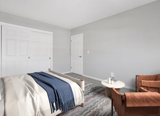 Model Bedroom with Carpet and Closet at Stone Ends Apartments in Stoughton, MA.