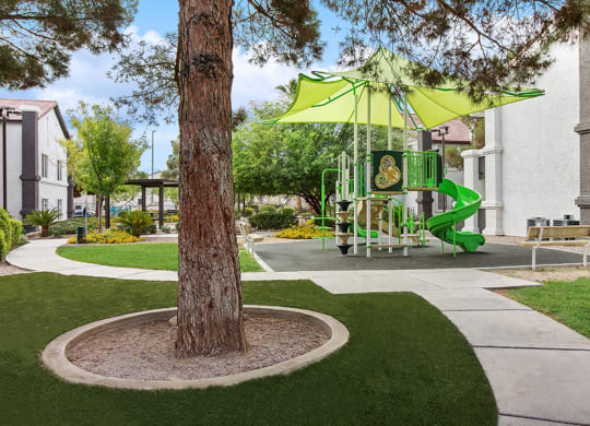 Exterior Landscape and View of Playground at Meadow Ridge Apartments in Las Vegas, NV.