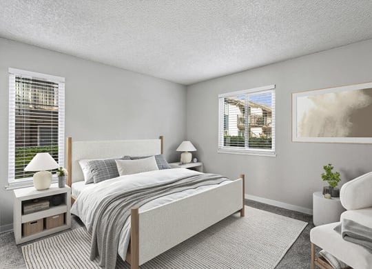 Model Bedroom with Carpet and Window Views at The Archer Apartments in Sacramento, CA.