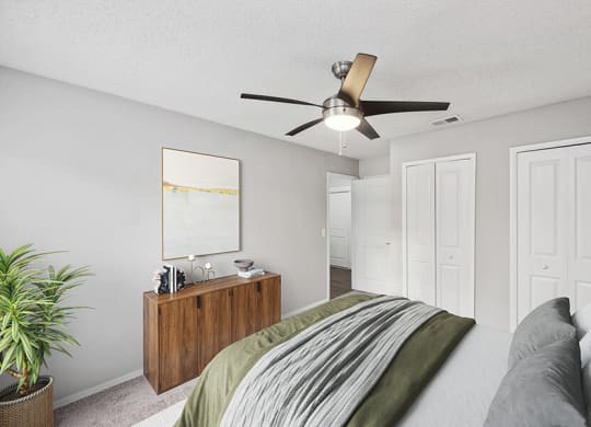 Model Bedroom with Carpet and Double Closets at Vue at Baymeadows Apartments in Jacksonville, FL.