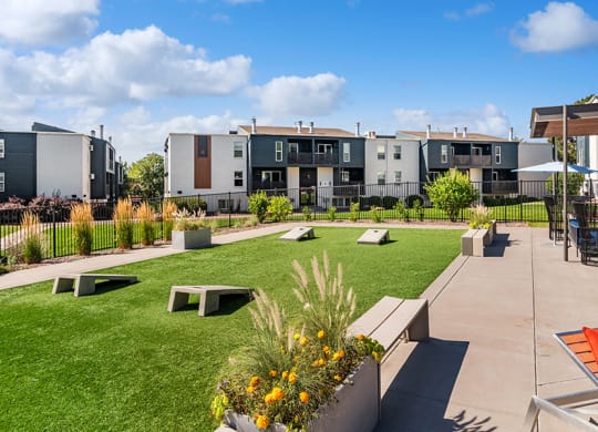 Outdoor Corn Hole Area at Waterfront Apartments in Lakewood, CO.