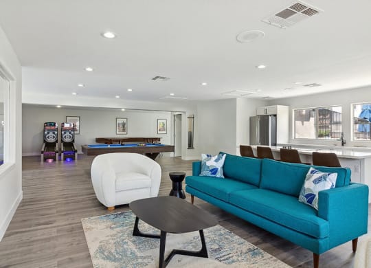 Community Clubhouse with Game Tables, Lounge Furniture and Kitchenette at Loma Vista Apartments in Las Vegas, NV.