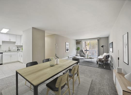 Model Living Room with Carpet and View of Kitchen/Dining Area at Middlesex Crossing Apartments in Billerica, MA.