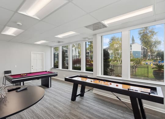 Community Clubhouse Game Tables at Fountains at Point West Apartments in Sacramento, CA.