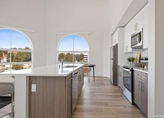 Model kitchen with large arch window