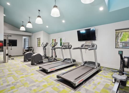 Community Fitness Center with Equipment and Treadmills at Creek 2645 Apartments in Sacramento, CA.