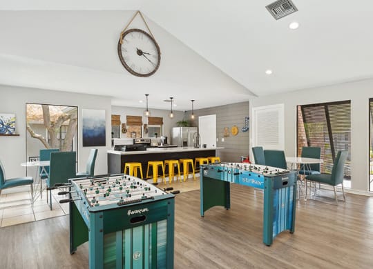 Community Clubhouse with Kitchenette and Game Tables at Grand Pavilion Apartments in Tampa, FL.