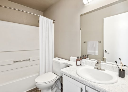 Model bathroom with white vanity s at Bella Vista Apartments in St. George, Utah.