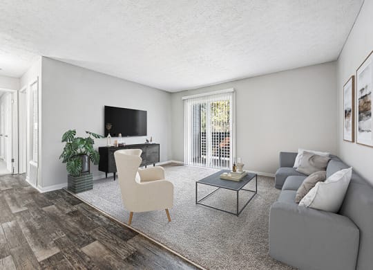 Model Living Room with Carpet and Patio Accessibility at Paramont Apartments in Duluth, GA.