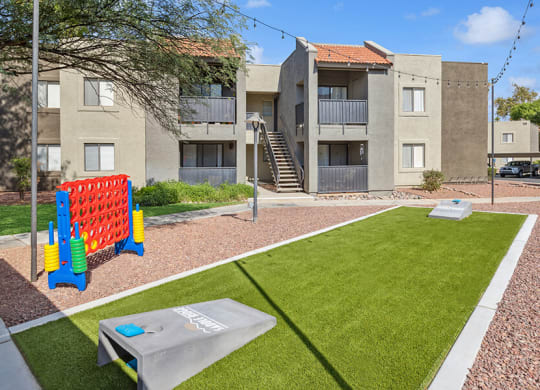 Outdoor Corn Hole Area at Saddle Ridge Apartments in Tucson, AZ.