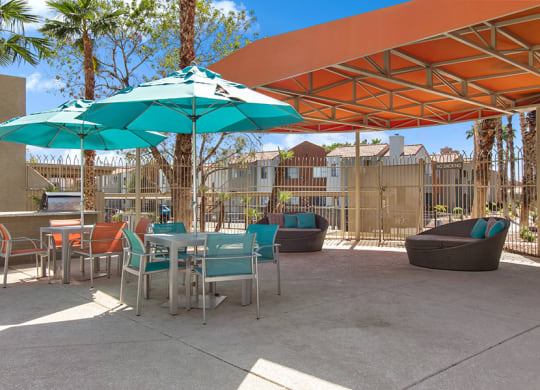 Community Swimming Pool Lounge Furniture & BBQ Area at Stonegate Apartments in Las Vegs, NV.