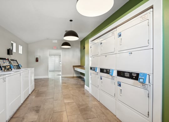 Community Laundry Center at Rosehill Preserve Apartments located in Orlando, FL.