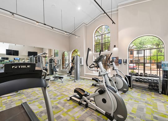 Community Fitness Center with Equipment at Dallas North Park Apartments in Dallas, TX.