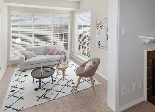 Model living room with large windows at Autumnwood, Arlington