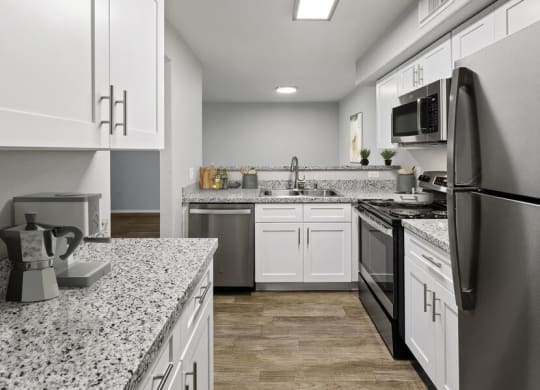 Model kitchen showcasing stainless steel appliances.