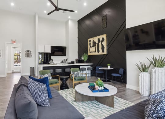 Community Clubhouse with Lounge Furniture, TV & Kitchenette Area at Monterra Apartments located in Las Vegas, NV.