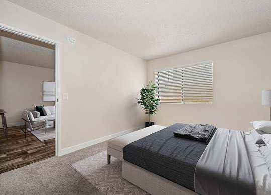 Model Bedroom with Carpet and Large Walk-In Closet at Butler Ridge Apartments located in Glendale, AZ.