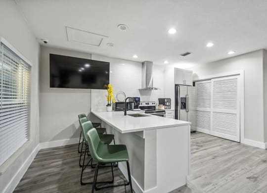 Community Clubhouse with Kitchenette Area and TV at Park at 7200 Apartments in Jacksonville, FL.