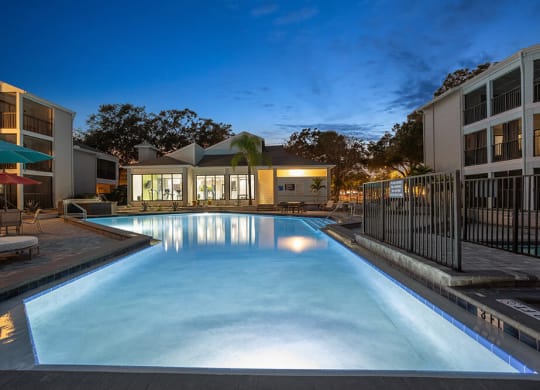 Community Swimming Pool with Pool Furniture at Haven at Water's Edge Apartments in Tampa, FL.