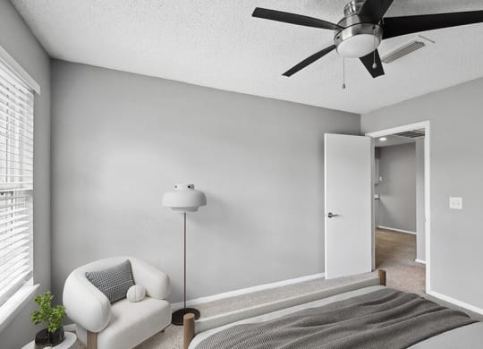 Model Bedroom with Carpet and Window View at Abbington Heights Apartments in Antioch, TN.