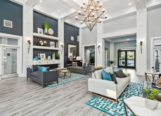 Community lounge with sofas at Park West Apartments in Houston, Texas