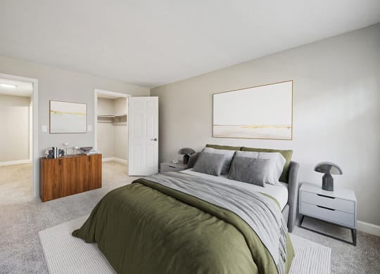 Model Bedroom with Carpet and Walk In Closet at Middlesex Crossing Apartments in Billerica, MA.