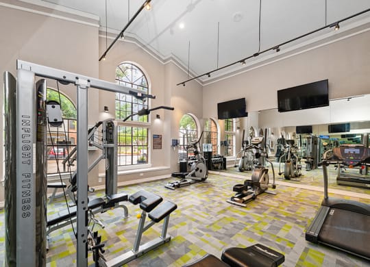 Community Fitness Center with Equipment at Dallas North Park Apartments in Dallas, TX.
