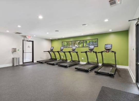 Community Fitness Center with Treadmills and Water Fountain at Dunwoody Village Apartments in Atlanta, GA.