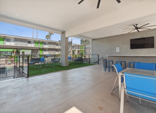 Covered outdoor lounge space near pool