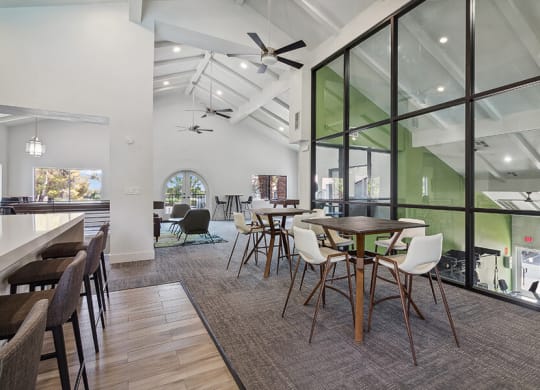 Community Clubhouse with Lounge Furniture and Kitchenette Area at Meadow Ridge Apartments located in Las Vegas, NV.