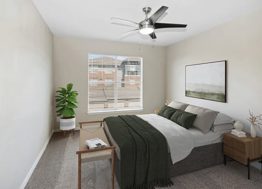 Model Bedroom with Carpet and Window View at Belmont at Belmont at Duck Creek Apartments in Garland, TX.