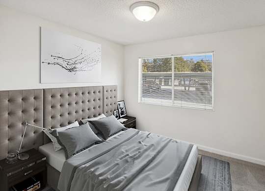 Model Bedroom with Carpet and Closet at Walnut Creek Apartments located in Walnut Creek, CA.