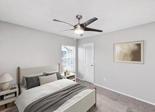 Model Bedroom with Carpet and Window View at Vue at Baymeadows Apartments in Jacksonville, FL.